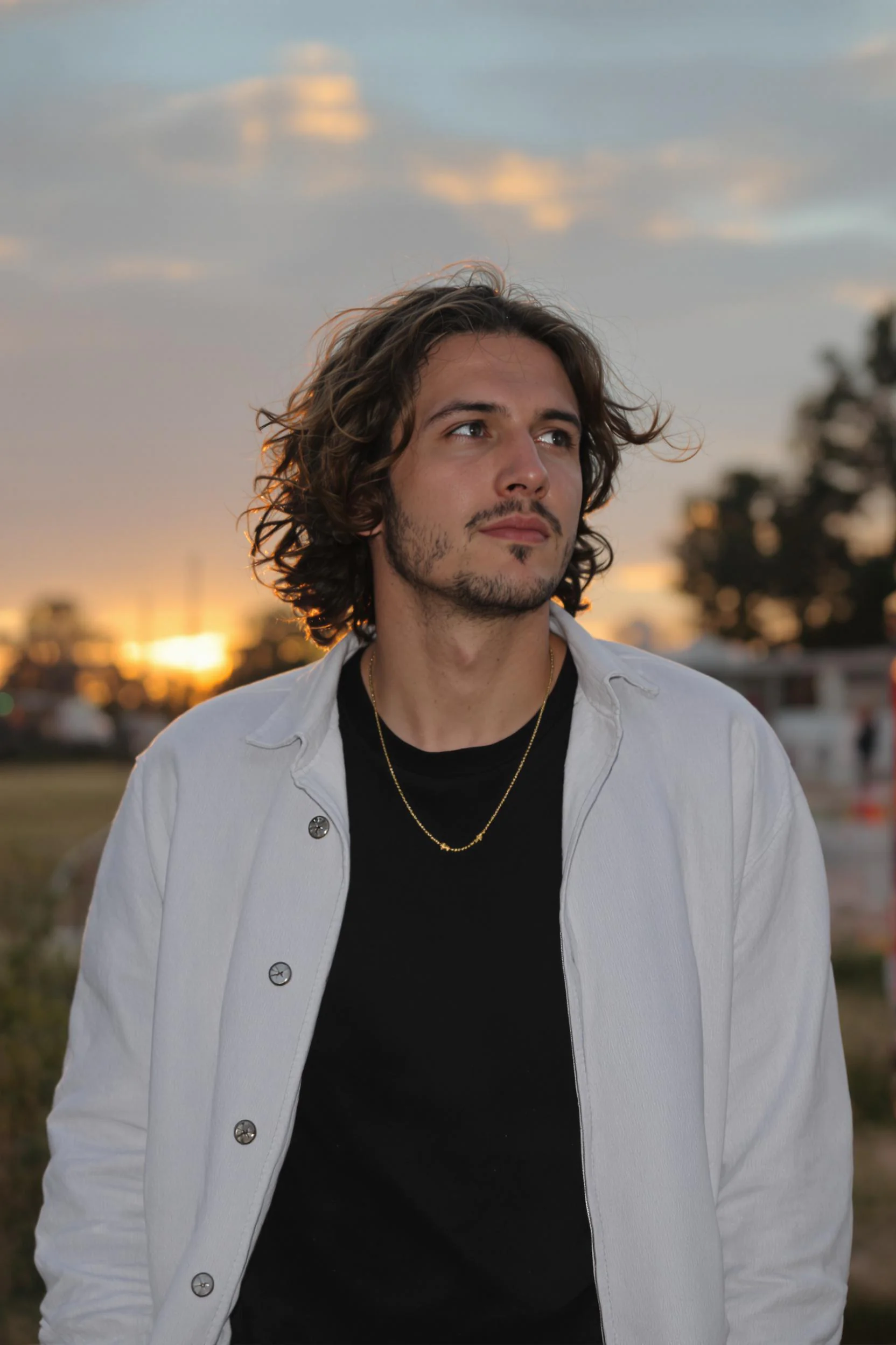 31 Best Haircut Ideas for Curly Men in 2025